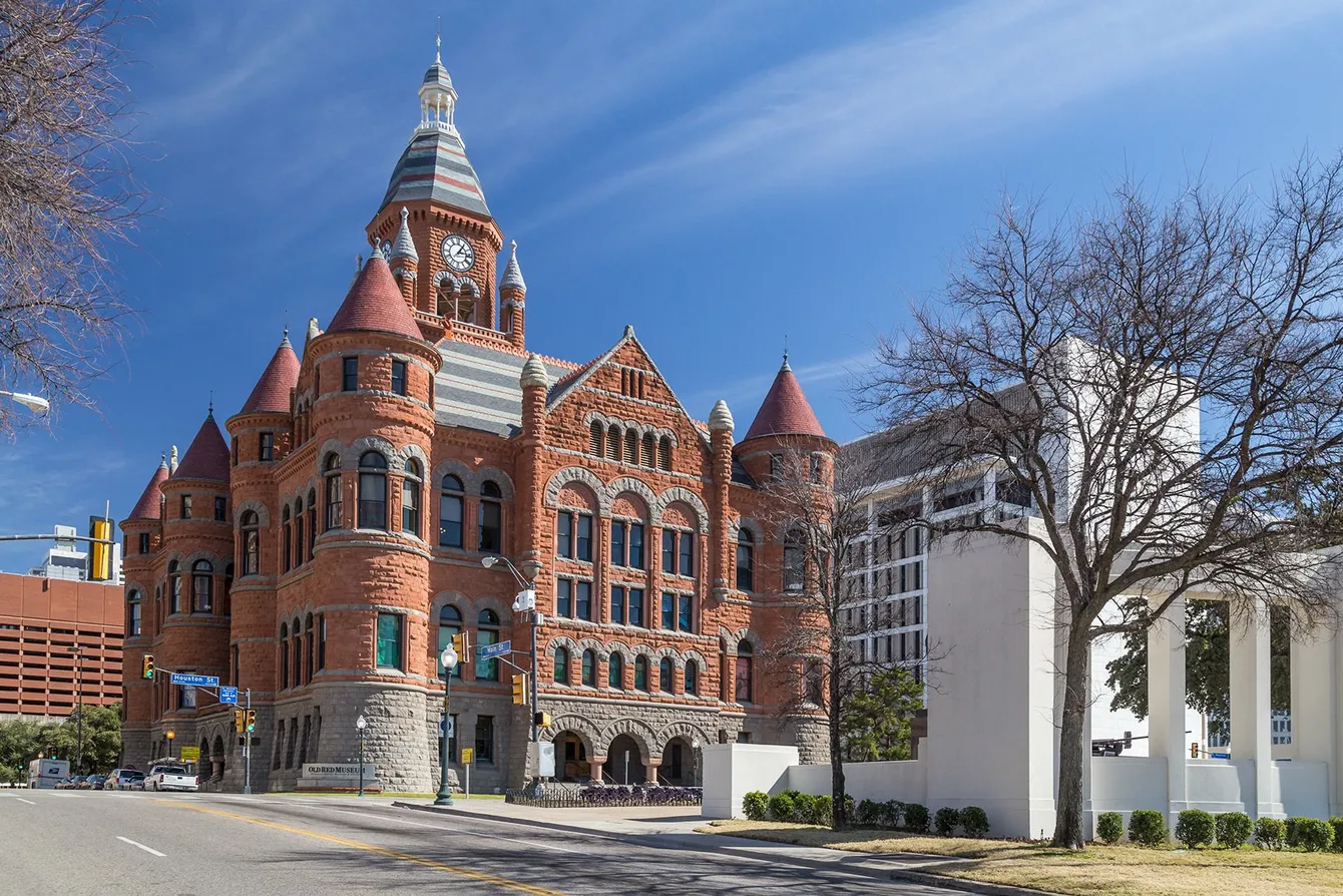 Old Red Museum, Dallas, Texas: a red brick courthouse with towers and a tall clock tower.
